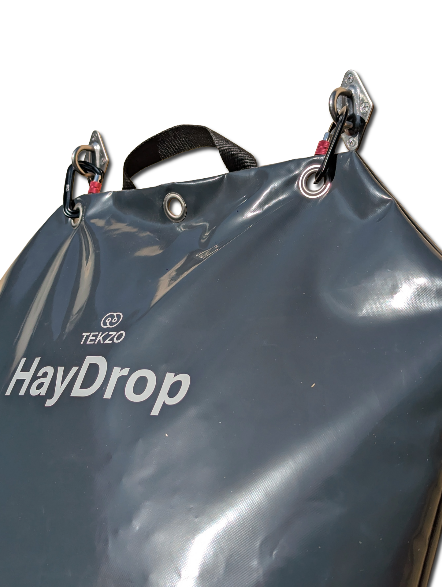 Gray bag labeled 'HayDrop' with 'Tekzo' branding on a white background